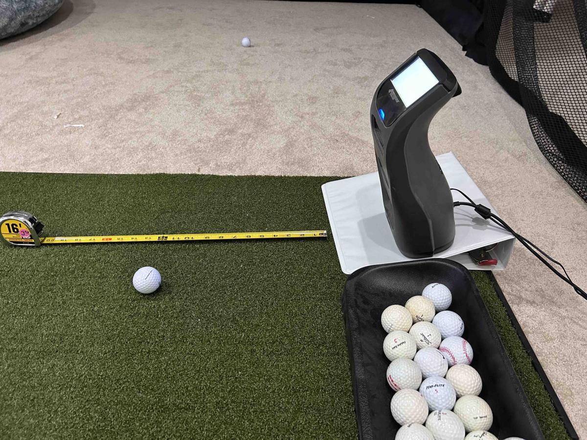 Foresight GC3 Angled On A 3" Binder To Simulate TopGolf