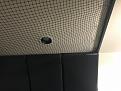 1" Furring strip covered with black vinyl with eye bolts screwed in to hold the net with zip ties.