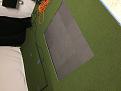 Hole cut in turf for mat.  Pic taken before foam tiles were also cut out.   You cannot see it well in this pic but the turf is curling up along the front and back cuts that run parallel to the screen.