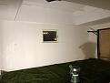 The screen is to be placed on the Wall where the garage door is.