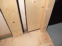 View of the 2x2 and board forming the support for the protective carpet roll which prevents shots from hitting the angle iron which supports the impact screen.