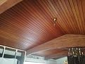 Ceiling of room with beams.