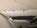 Rear of screen showing bungee cords holding screen