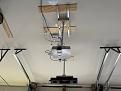 DIY projector rail using pocket door track and trollies.
