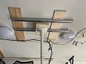 DIY projector rail using pocket door track and trollies