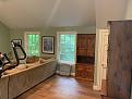 Standing at back of room looking to right