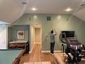 Standing at back of room looking to front/hallway