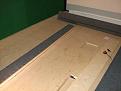Ceiling baffle being assembled. PEF covered by carpet screwed to baffle support