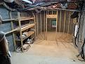 Unfinished basement room approx 30ft x 15ft with stepped down concrete floor