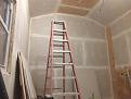Screen wall. Added plywood strips to put eye screws in for hanging..